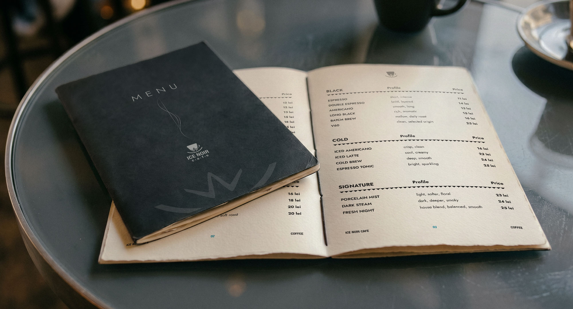 Ice Noir Cafe printed menu booklet on a cafe table with warm ambient lighting