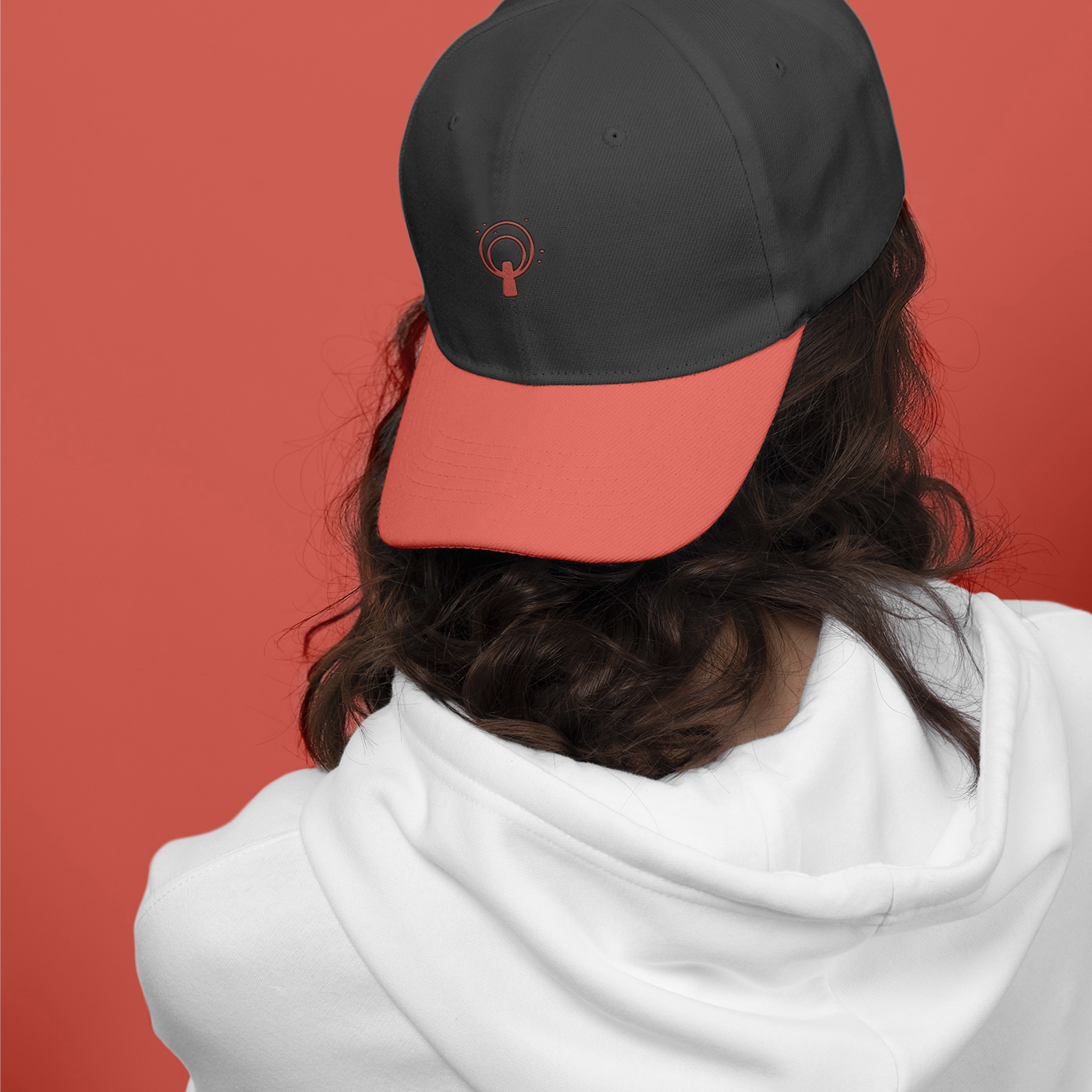 Flavi Predu cap mockup with coral brim and logomark