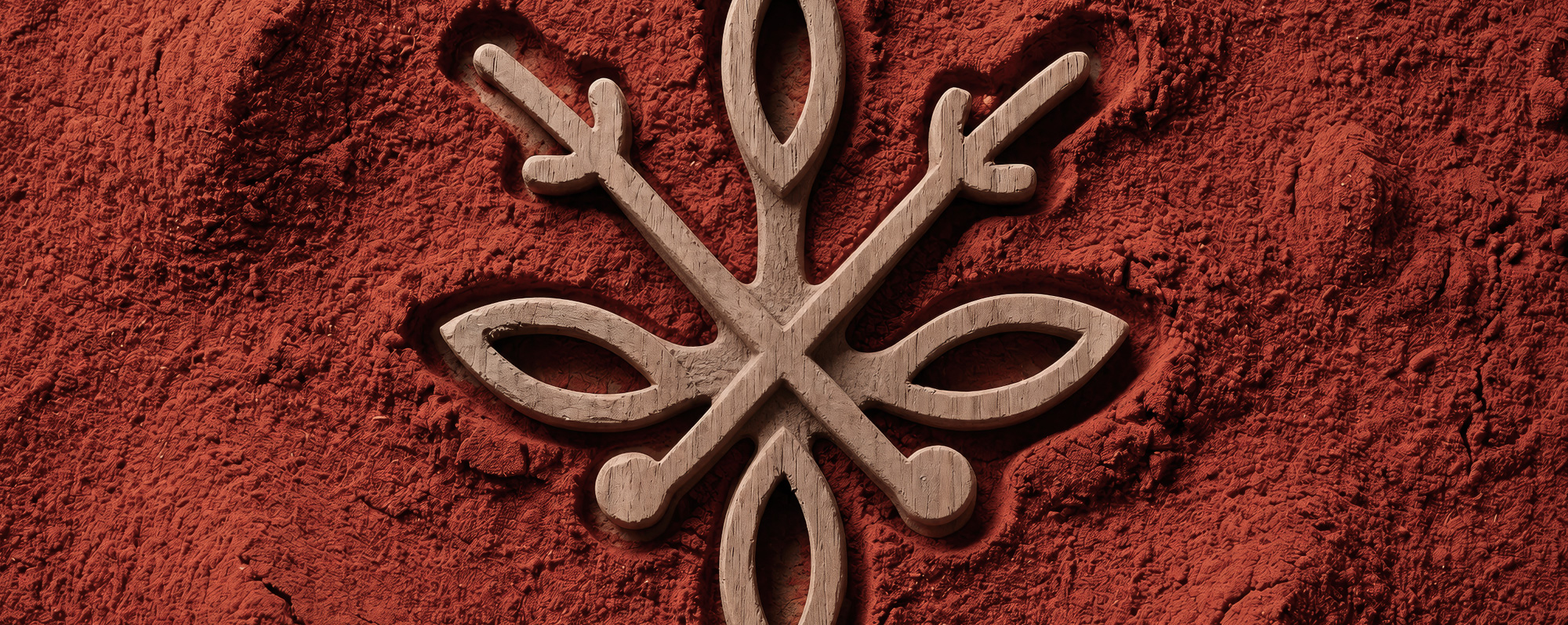 Sense Organica wooden botanical mark on an earthy red textured background