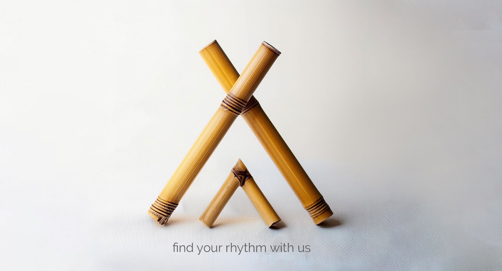 Catrooboo Art Tribe logo and tagline alongside a bamboo structure